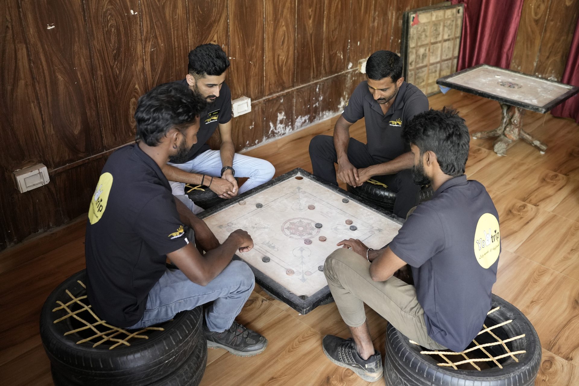Guests playing carrom in the games room
