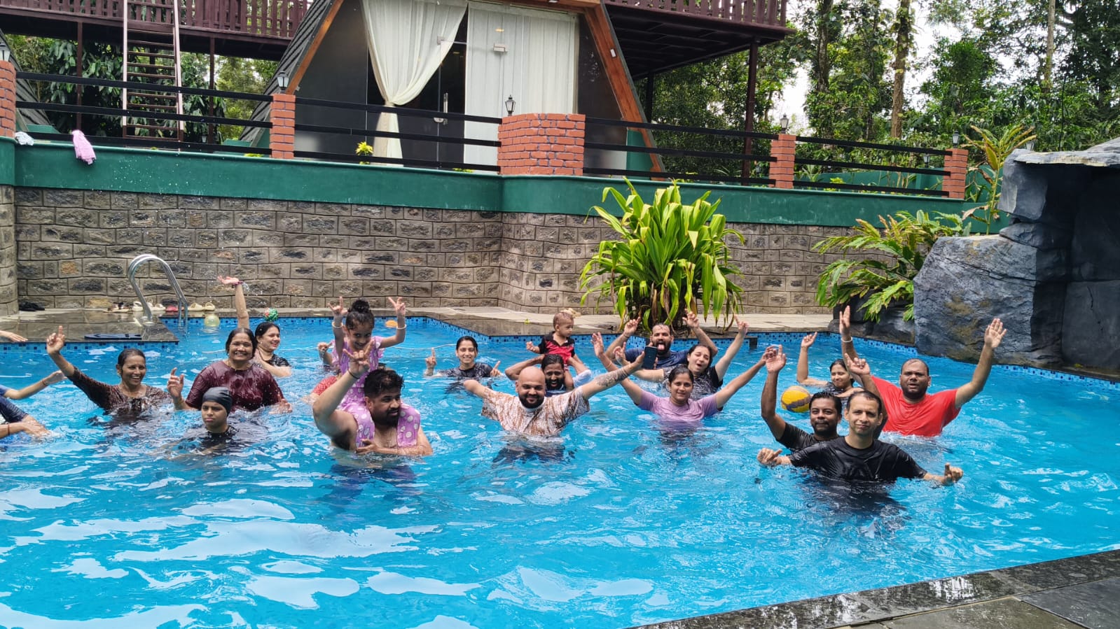 Guests cheering in the resort swimming pool