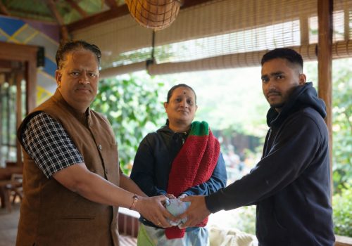 A friendly super host at Evergreen County resort assisting guests with premium amenities and traditional hospitality.